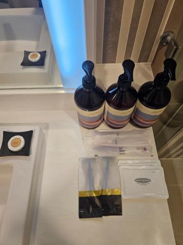 three vases sitting on top of a counter at Incheon Airport Global Hotel & Suites in Incheon