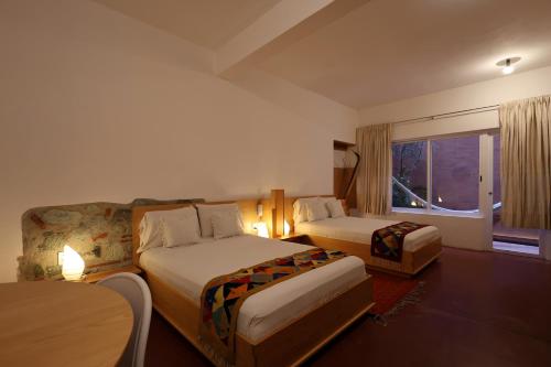 Ein Bett oder Betten in einem Zimmer der Unterkunft Hotel Ayook