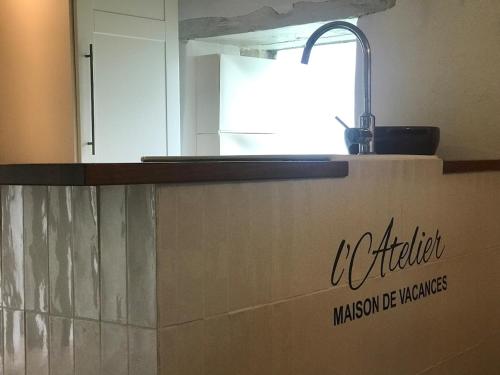 a kitchen with a sink and a counter top at L'Atelier, Confort, Bain à remous et Nature in Parisot-Tarn-et-Garonne