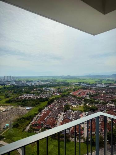 a view of a city from a balcony at Meritus Suites - 8pax in Perai