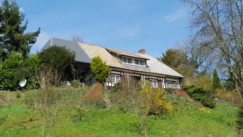 a house sitting on top of a hill at Pré Le Duc in Broglie