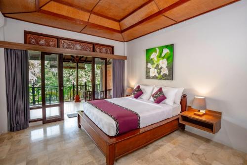 Voodi või voodid majutusasutuse Mumbul Ubud toas