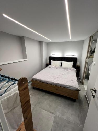 a bedroom with a bed in a room at Mandouki Urban Stay in Corfu