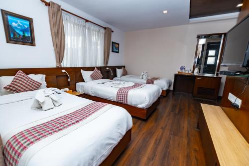 Kathmandu Suite Homeにあるベッド