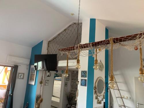 a living room with blue and white walls at Seaview Young Family - Семейство на Черно море in Aheloy