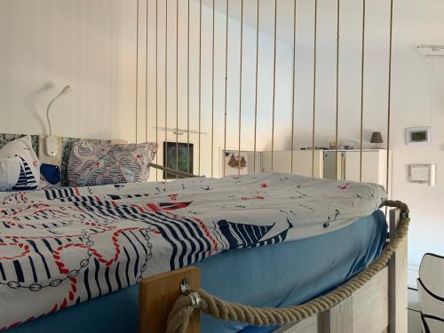 a bed in a room with aoked at Seaview Young Family - Семейство на Черно море in Aheloy