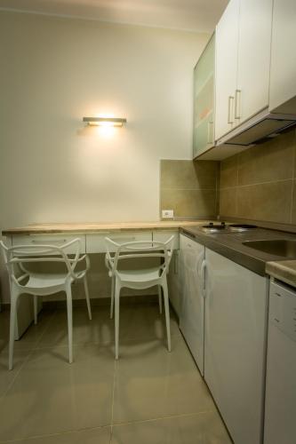 Kuchyň nebo kuchyňský kout v ubytování Apartments Jevremova