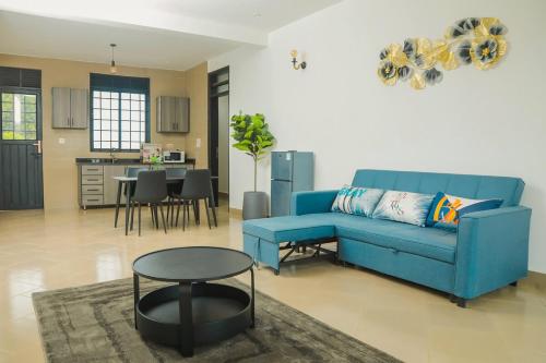 Cozy 2BR Apt With free WiFi & Parking Bweya Kajjansiにあるシーティングエリア