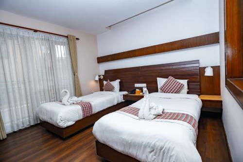 Kathmandu Suite Homeにあるベッド