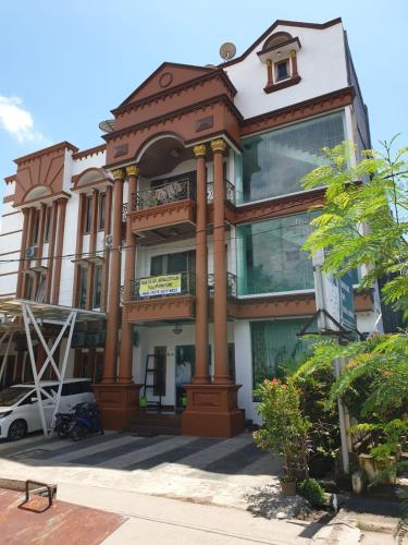 a building with a balcony on the side of it at Kost Wisma Erbyta 2 in Cilegon