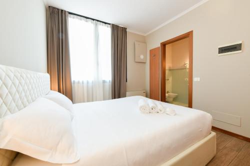 Postel nebo postele na pokoji v ubytování Hotel Garda
