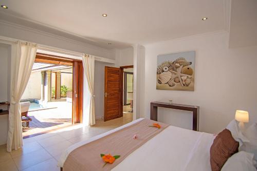 Postel nebo postele na pokoji v ubytování Oasis 2 Paradise
