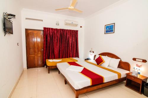 Ein Bett oder Betten in einem Zimmer der Unterkunft Jasmine Palace