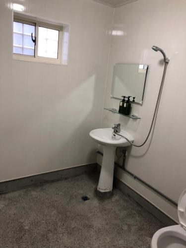 a bathroom with a sink and a mirror at 綠島夏御 微熱海岸 in Green Island