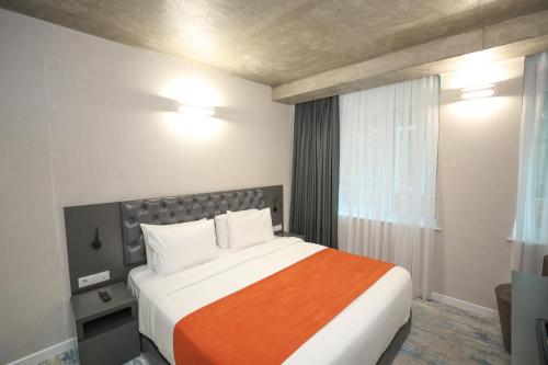 Postel nebo postele na pokoji v ubytování Hotel MTbilisi