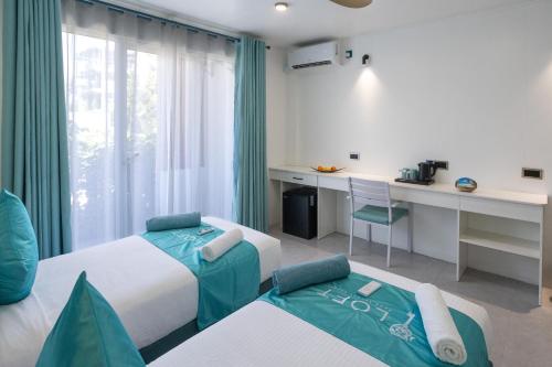 Una cama o camas en una habitación de LOFT Maldives