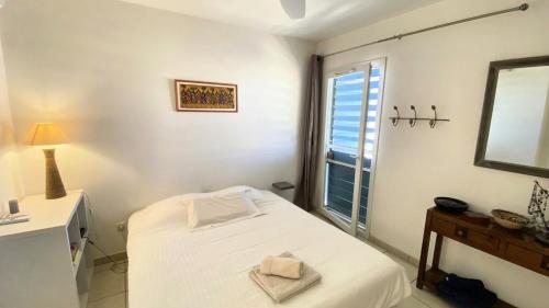 Ένα ή περισσότερα κρεβάτια σε δωμάτιο στο Appt Blue lagoon vue mer à La Saline les bains