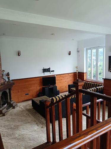 a room with chairs and a stage in a church at Havelock Inn in Nuwara Eliya