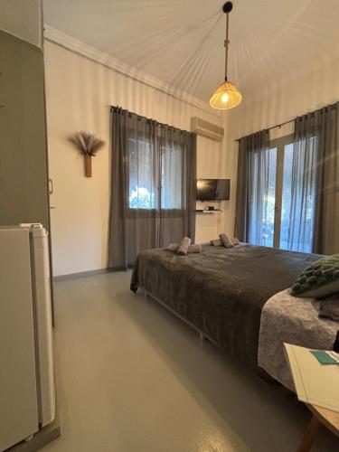 a bedroom with a bed and a large window at Rooms the other side of the island by Patitiri in Saterlí