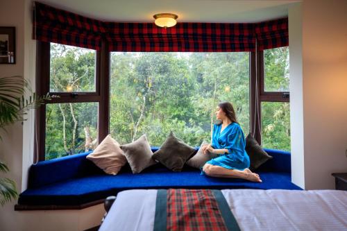 Postel nebo postele na pokoji v ubytování Old Kent Estates & Spa, Coorg