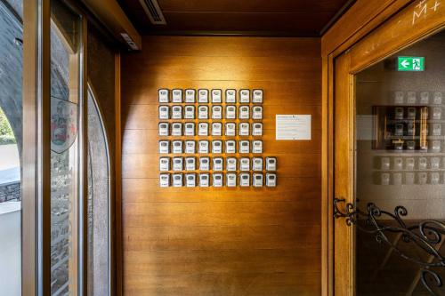 a wooden door with a bunch of numbers on it at keyone rooms Finkenberg in Finkenberg