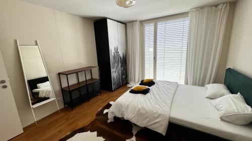 Postel nebo postele na pokoji v ubytování Cozy Apartment near Zurich