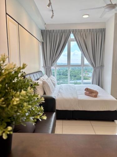 a bedroom with a bed and a couch and a window at KSL Modern Studio 1-2Pax #Daya#Austin#Ikea#Aeon in Johor Bahru