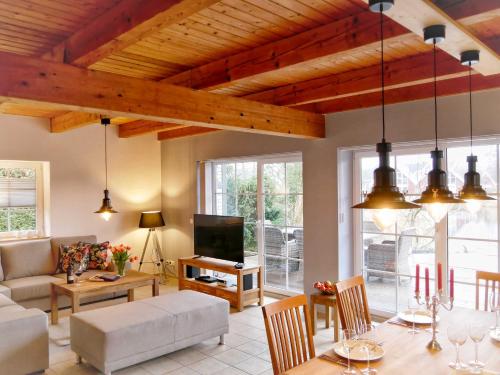 a living room with a couch and a table at Ferienpark Scharmützelsee in Wendisch Rietz
