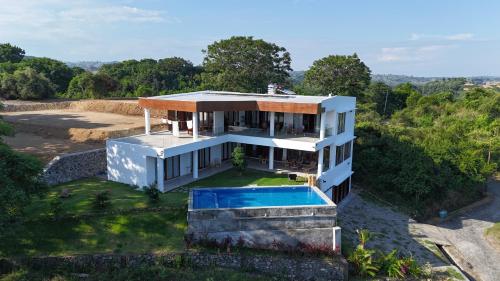 an aerial view of a house with a swimming pool at Villa Ayu Lombok in Kuta Lombok