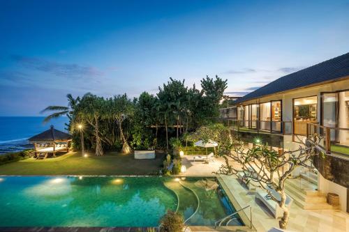 an aerial view of a house with a swimming pool at Karang Saujana in Uluwatu
