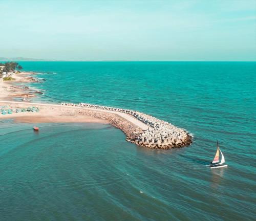a boat in the water near a small island in the ocean at Căn hộ c414 in Ấp Phú Tịnh (2)