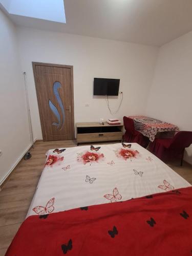 a bedroom with a bed with butterflies on it at Sea Wave House in Constanţa
