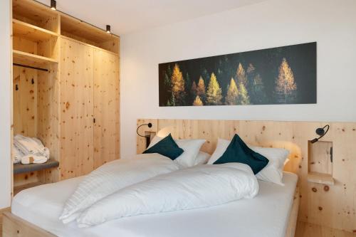 Ένα ή περισσότερα κρεβάτια σε δωμάτιο στο Chalet Magdalena und Lodges