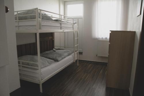 Postel nebo postele na pokoji v ubytování Apartmán Pasohlávky - rodinný komfort se dvěma ložnicemi a kuchyní