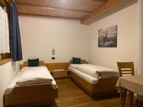 Postel nebo postele na pokoji v ubytování Apartments Nadia