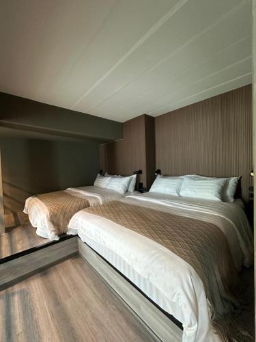 Кровать или кровати в номере Thai Loft 泰閣