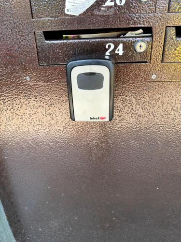 a close up of a camera with the number on it at Апартамент Миели in Sofia