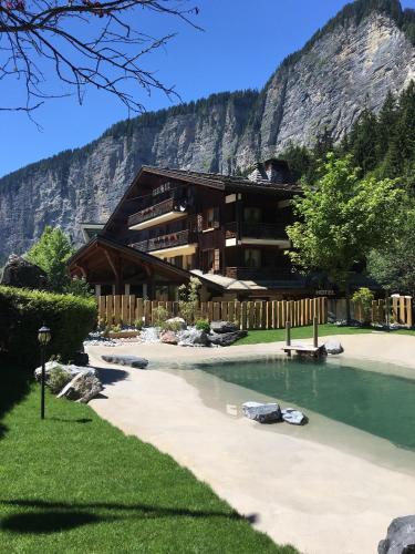 a building on the side of a mountain at le A by neige et roc in Morzine