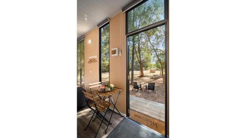 a view from the hallway of a house with large windows at Manna Gum Retreat by Tiny Away in Allansford