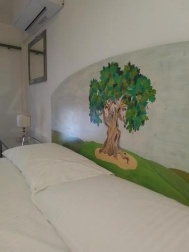 Ένα ή περισσότερα κρεβάτια σε δωμάτιο στο La terrazza di Villa Edera