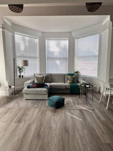 a living room with a couch and a table at On The Avenue Apt 4 in Nottingham