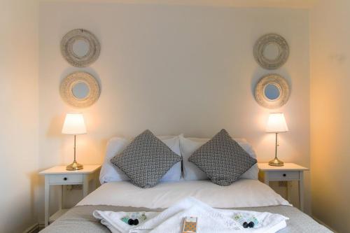 a bedroom with a bed with towels on it at Walton by Holmesdale Homes in Milton Keynes