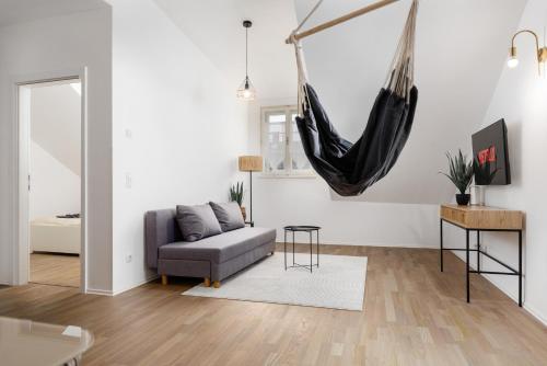 a living room with a hammock hanging from the wall at Design-Apartments in der Braunauer Altstadt in Braunau am Inn