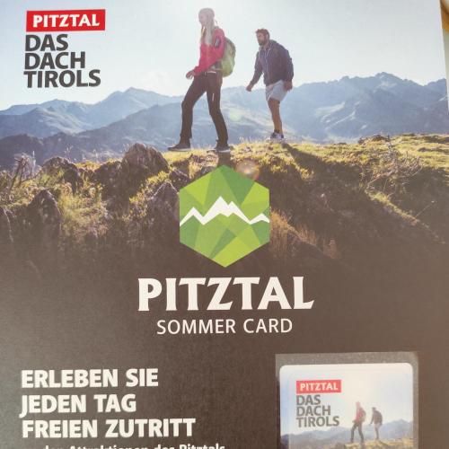 a magazine cover with two people standing on top of a mountain at Apart Gschwandthof in Sankt Leonhard im Pitztal