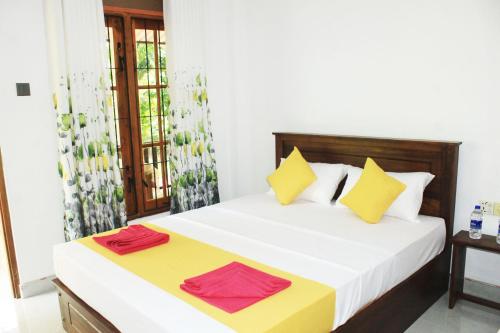 Ένα ή περισσότερα κρεβάτια σε δωμάτιο στο Sigiri Garden Villa