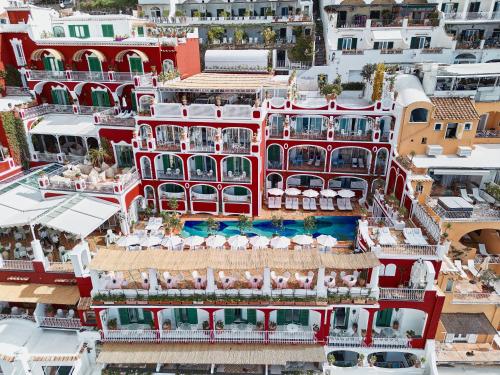 an aerial view of a building with a pool at Le Sirenuse in Positano