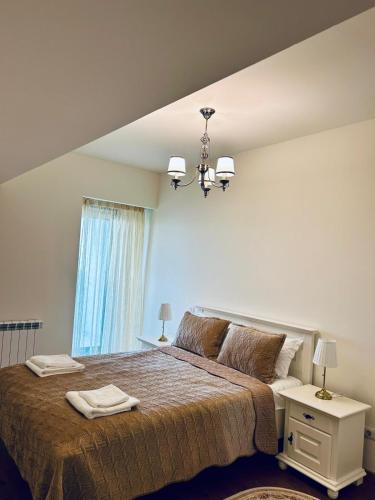 a bedroom with a large bed and a window at Aparthotel Mirage Sunset - zona hotel Rex in Mamaia