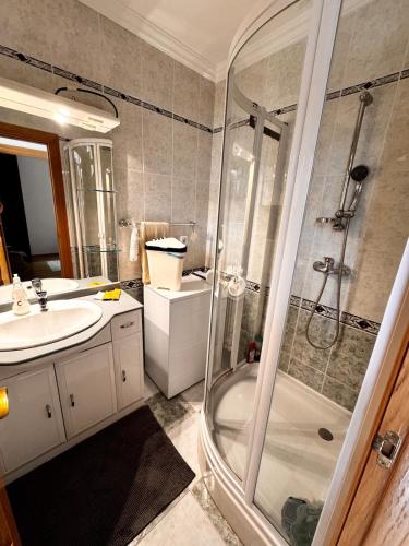 a bathroom with a shower and a sink at Bliss Apartment Balatonfured in Balatonfüred