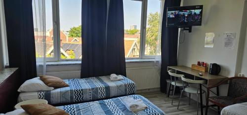 Postel nebo postele na pokoji v ubytování Hotel Baan
