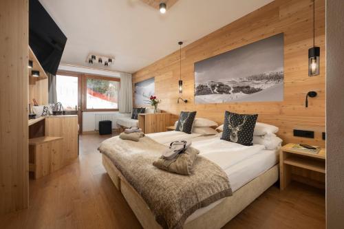 Postel nebo postele na pokoji v ubytování Hotel Dahu